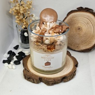 birthday cake candle by MysticGlow with whipped wax and chocolate pieces